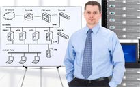 Man in front of whiteboard outlining a Network Server Setup