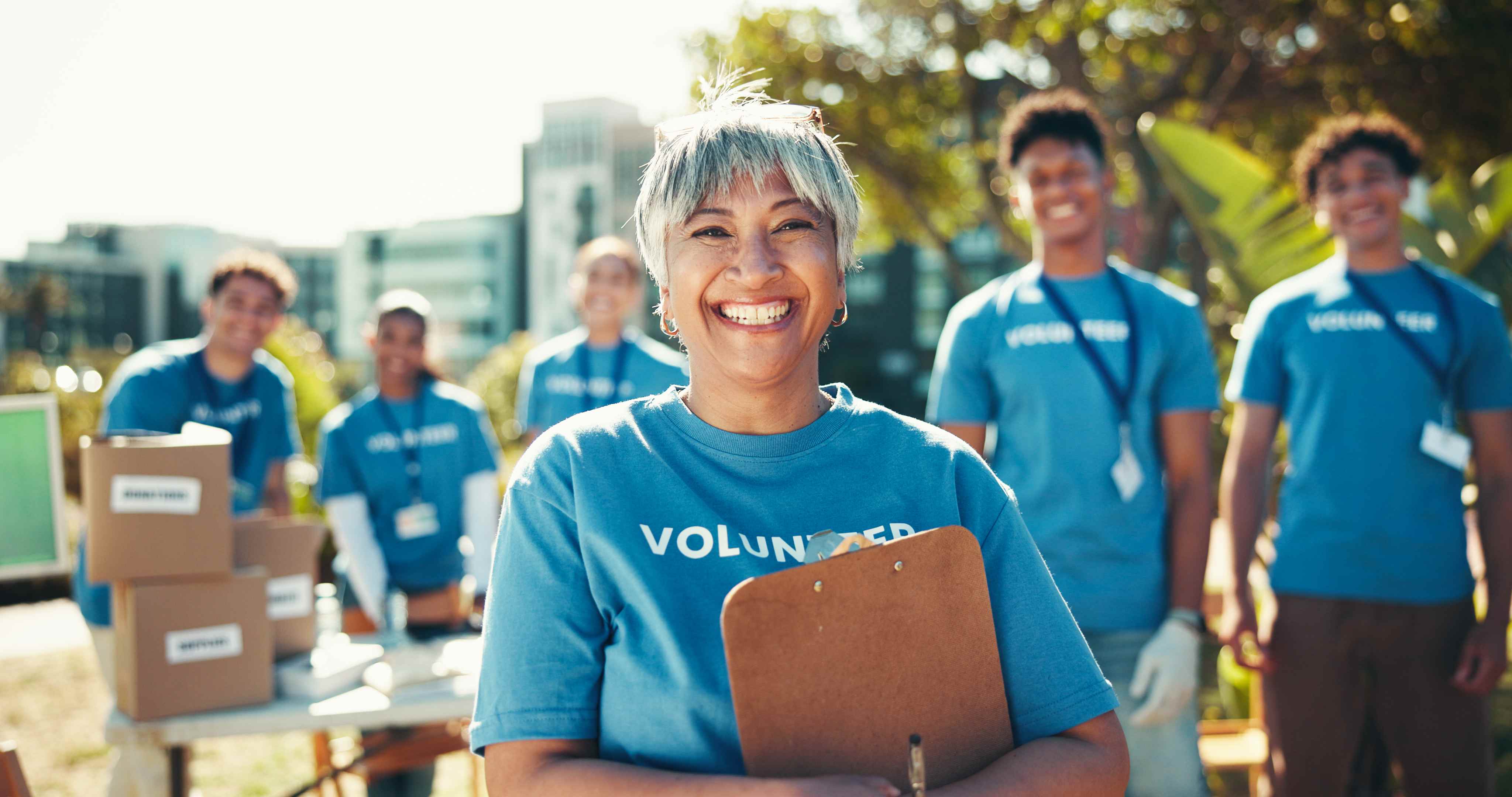 Non-profit volunteer team smiling outdoors