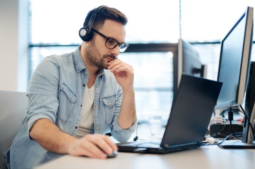 man on the phone with it support for his startup business