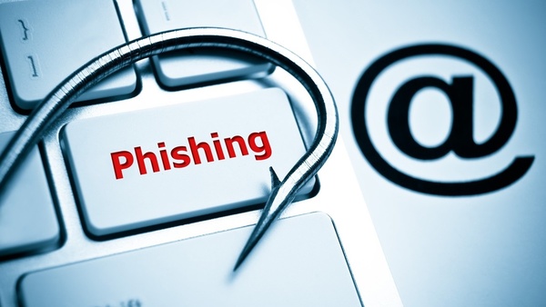 fish hook laying on red 'Phishing' keyboard key